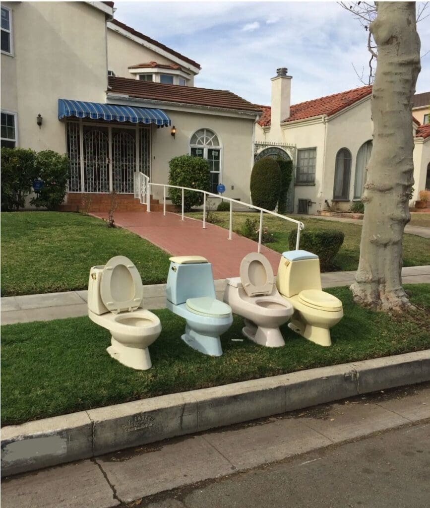 Toilets on Parkway Grass in Front of a House.