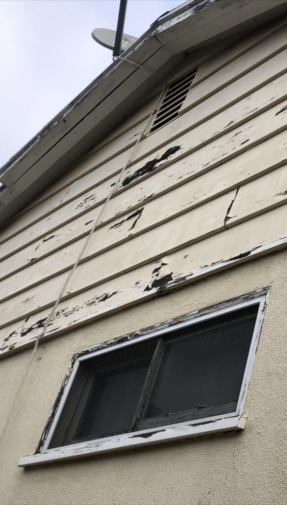 Peeling Paint on Wood Siding. 